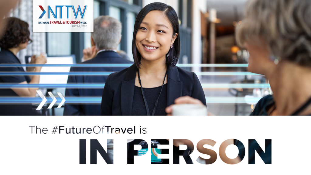 the future of travel is in person. Person smiling while working.