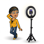 Bitmoji woman standing in front of a Ring light taking a selfie. 