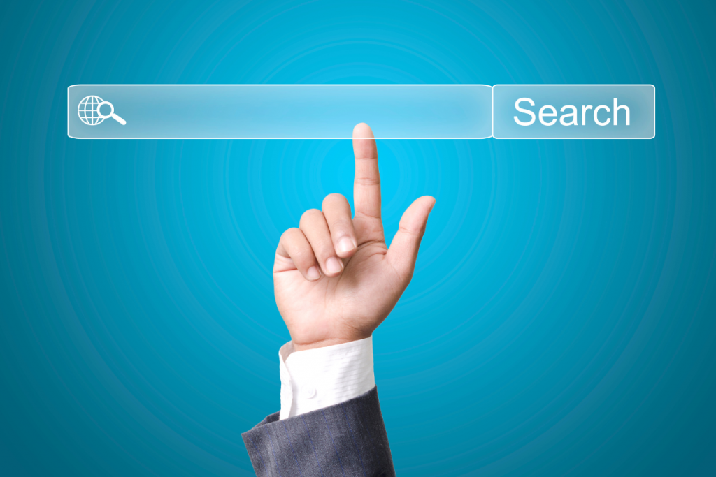 Person pointing to a search bar made for search engines.